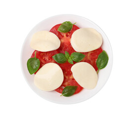 Plate of delicious Caprese salad with tomatoes, mozzarella and basil isolated on white, top view