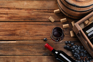 Winemaking. Flat lay composition with tasty wine and barrel on wooden table, space for text - obrazy, fototapety, plakaty