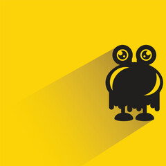 funny monster with shadow on yellow background