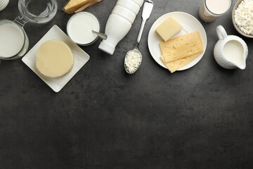 Many different lactose free dairy products on grey textured table, flat lay. Space for text
