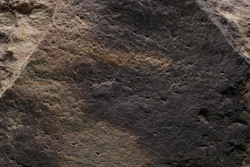 Gray stone texture, dark abstract background. Natural mineral rock close up details, empty backdrop with copy space for design