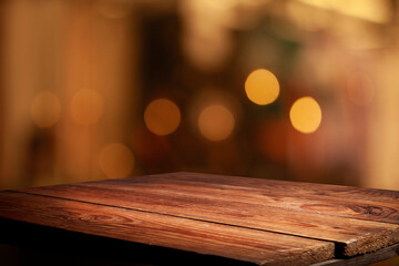 Empty beautiful wooden tabletop and blurred bokeh modern cafe interior background in clean and...