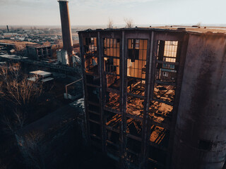 Aerial view of old abandoned building, skyscraper in the city. Old derelict building in bad state.