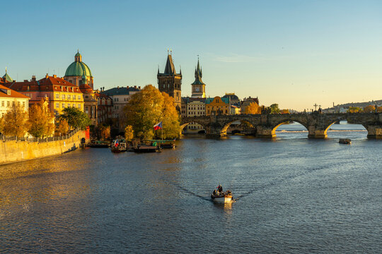 Boat going away from Charles Bridge and Old Town Bridge Tower, Prague, Bohemia, Czech Republic