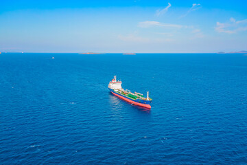 Naklejka na ściany i meble Aerial shot of Oil chemical tanker on anchorage in Mediterranean sea near logistics port