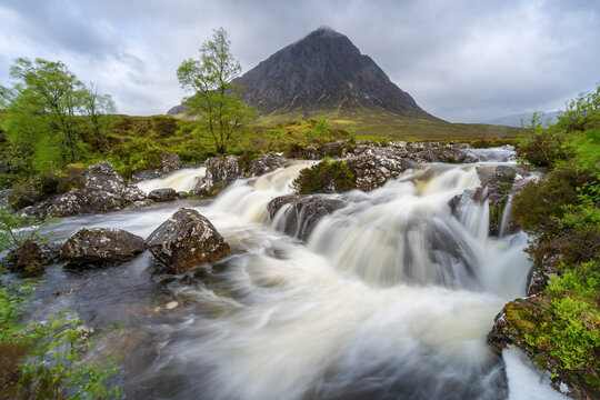 River Coupall flowing through rocks against Buchaille Etive Mor mountain in Glen Coe, Highland Region, Scotland, United Kingdom