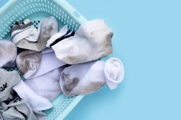 Dirty white socks in laundry basket