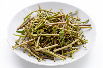 Water convolvulus or water spinach on white background.