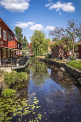 Fototapeta na wymiar Reflections on the river at the idyllic village of Eksjö, Jönköping, Sweden