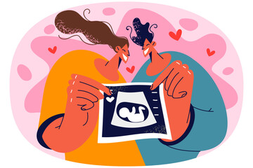 Happy couple show ultrasound scan