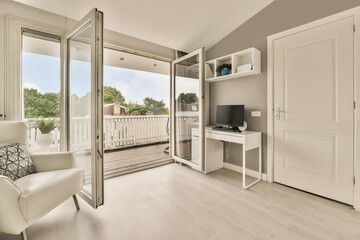 Interior of room with furniture and door for balcony