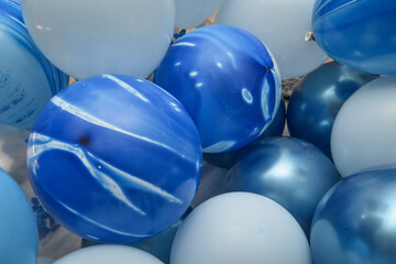 different blue balloons at a birthday party for boys