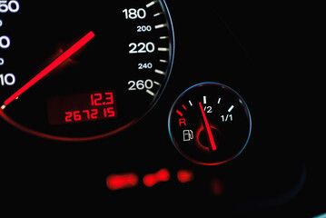 Car's dashboard.Modern car dashboard panel at night time.Closeup,selective focus.