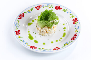 russian salad on the white plate