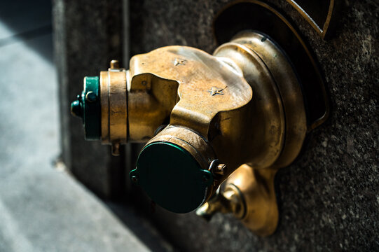 Fire hydrant on wall in city