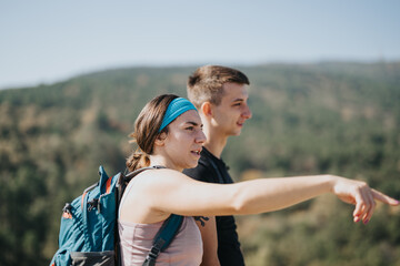 Young friends hike through a beautiful forest, enjoying nature and engaging in lively conversations. They embrace a healthy and active lifestyle while creating unforgettable memories.
