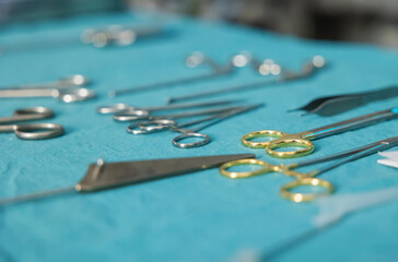 Set of various scissors and tools placed on table in clinic