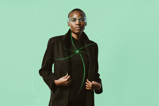 Confident woman in smart glasses and long coat with laser pattern