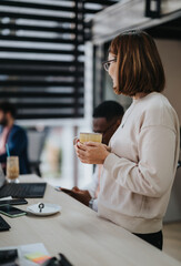 Young business professionals collaborate in a corporate office, analyzing market research and developing strategies for growth.