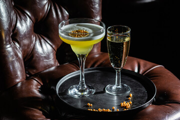 Cocktail with ice on a dark background. Bar