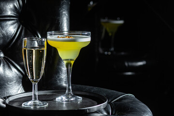 Cocktail with ice on a dark background. Bar