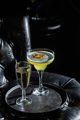 Cocktail with ice on a dark background. Bar
