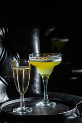 Cocktail with ice on a dark background. Bar