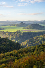 Stunning mountain views from a cliff at a very high altitude. Picturesque landscape with beautiful views in the sunlight. Saxon Switzerland, near Dresden, Germany