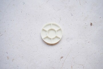 Miniature kitchen utensils on a white background, top view, copy space for text