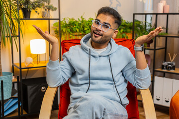 What. Why. Frustrated Indian man raising hands in indignant expression, asking reason of failure,...