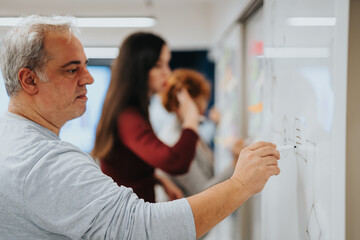 Obraz premium Business colleagues in a corporate office brainstorm and collaborate, analyzing data for profit growth and business expansion.