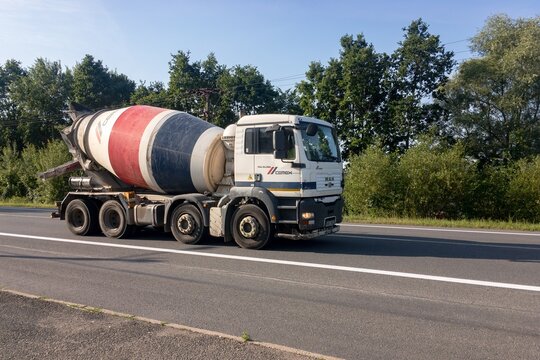 MAN TGA 35.360 mixer truck of Cemex company delivering concrete