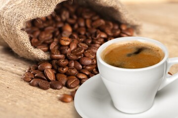 Espresso hot coffee with aroma coffee beans on desk