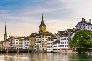 Naklejka na ściany i meble Scenic view of historic Zurich city center with famous Fraumunster and river Limmat at Lake Zurich,Switzerland