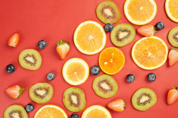Fruits and Berries on Red Background