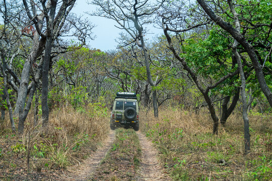 Jeep driving through the Cangandala National Park, Malanje, Angola
