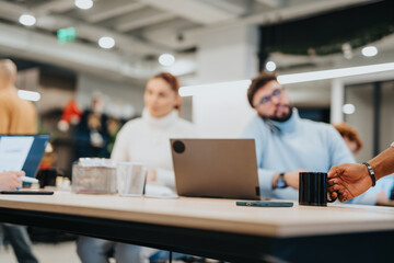 Diverse professionals collaborating in an office for business success. Focused on market analysis and financial planning. Encouraging teamwork and sharing innovative ideas.