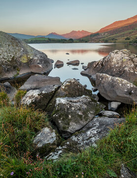 Rocks and lake at sunrise, Llynnau mymbyr, Capel Curig, Snowdonia National Park, Wales