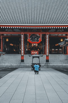 A tourist taking picture of the Senso ji Temple in Tokyo, Honshu, Japan