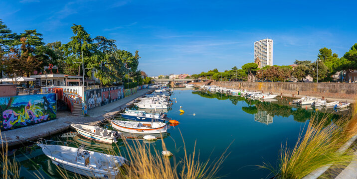 View of boats and reflections on the Rimini Canal, Rimini, Emilia-Romagna