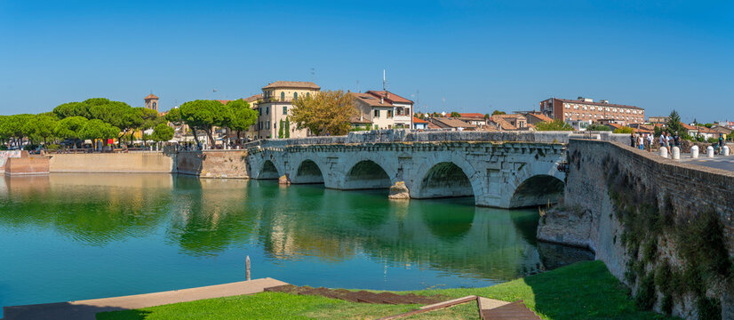 View of Ponte di Tiberio reflecting in Rimini Canal in Borgo San Giuliano district in Rimini, Rimini, Emilia-Romagna