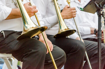 ands and trumpets of symphony orchestra musicians close up