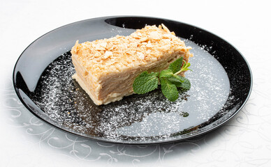 Napoleon cake. Layered pastry with custard. Isolated image