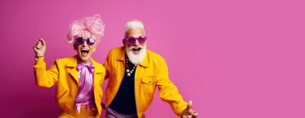 Cool retired hipsters, seniors party, carnival. Portrait of cheerful elderly gray-haired bearded grandparent wearing funny sunglasses and bright extravagant clothes on plain pink background - obrazy, fototapety, plakaty