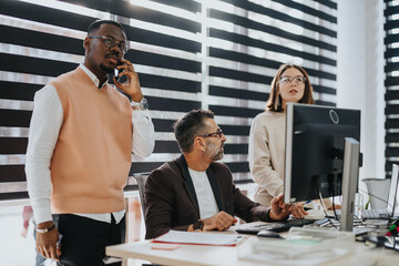 Diverse business team collaborating on strategy and problem-solving for successful profit growth.