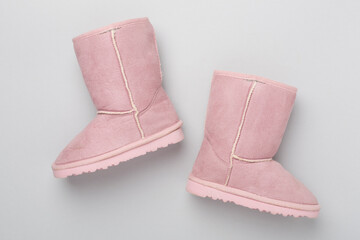 Beautiful boots on color background,top view