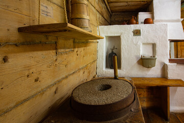 Ancient traditional clay stove in ancient wooden house in Lviv region