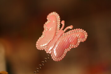 Closeup of a Pink Butterfly angel or hair band attached with spring
