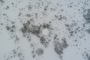 Winter nature scene of Estonia. Observation tower on the Viru swamp in winter. Quadcopter view.