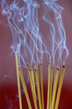 Incense sticks on joss stick pot burning, smoke used to pay respect to the Buddha, Vung Tau, Vietnam, Indochina